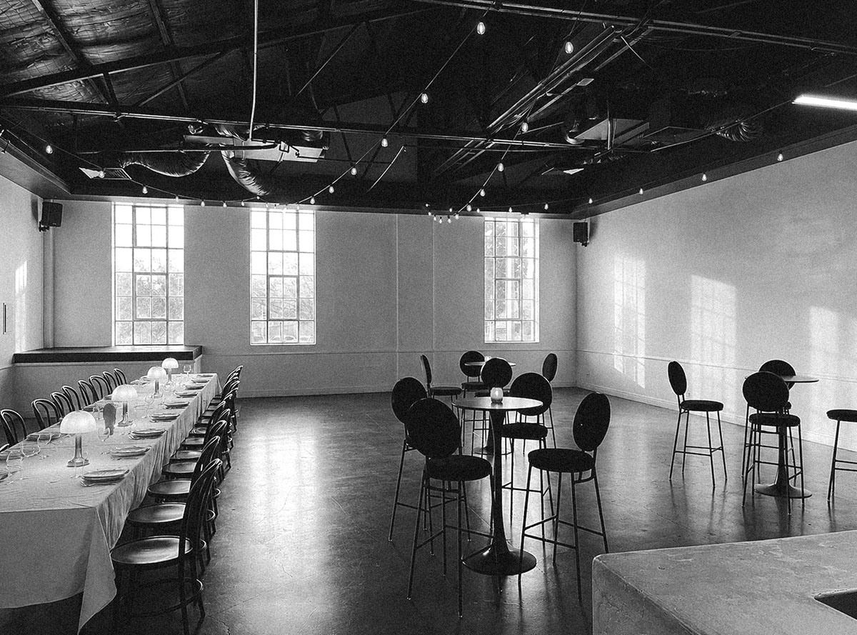 a cocktail function in the gallery room at cleaver house event space